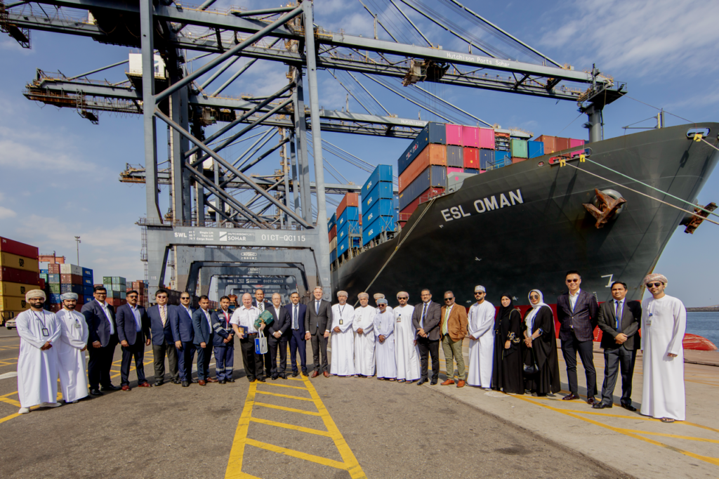 ESL and Hutchison Ports Sohar team standing in front of ESL Oman.